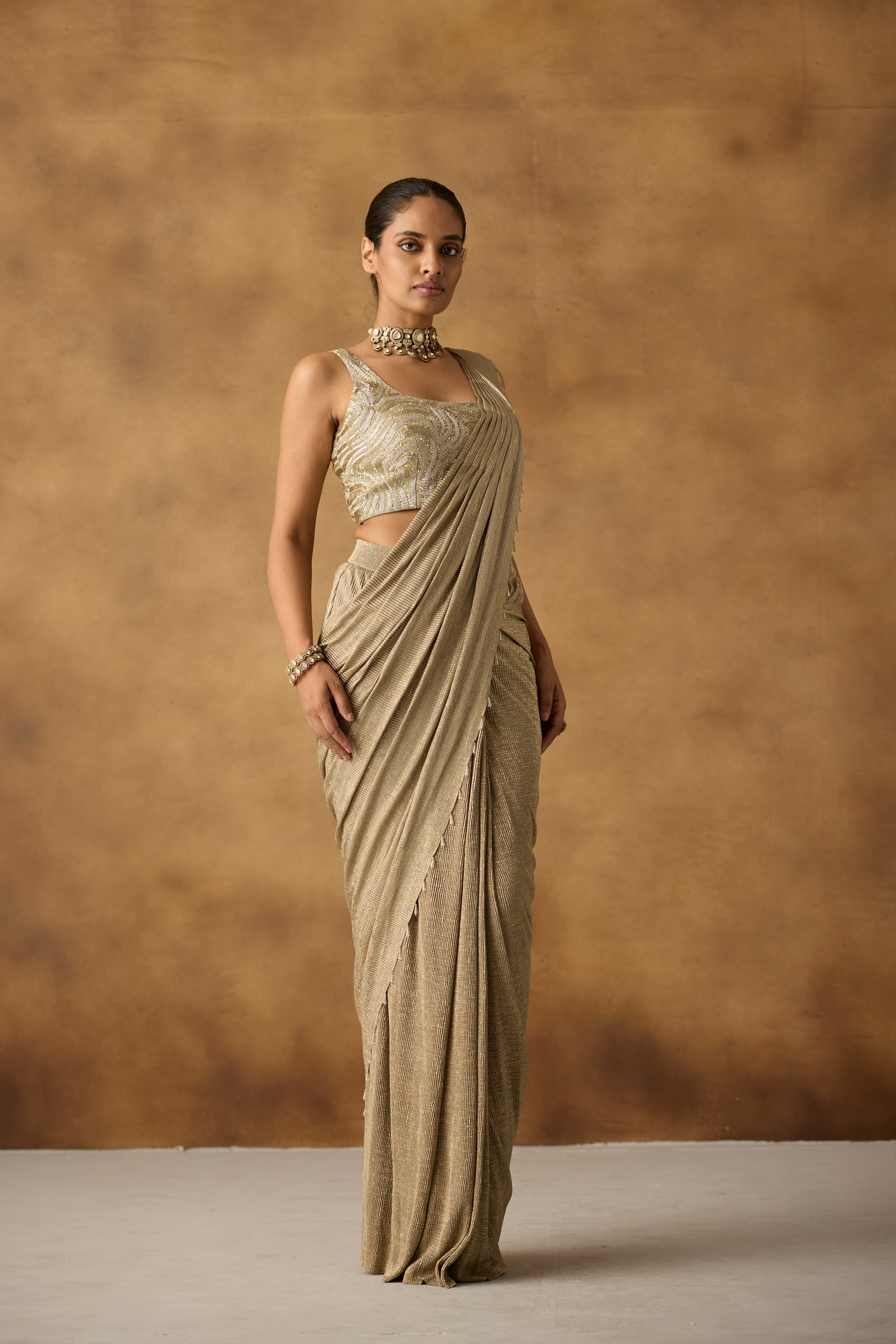 Beige Gilded Embellished Crepe Silk Draped Saree